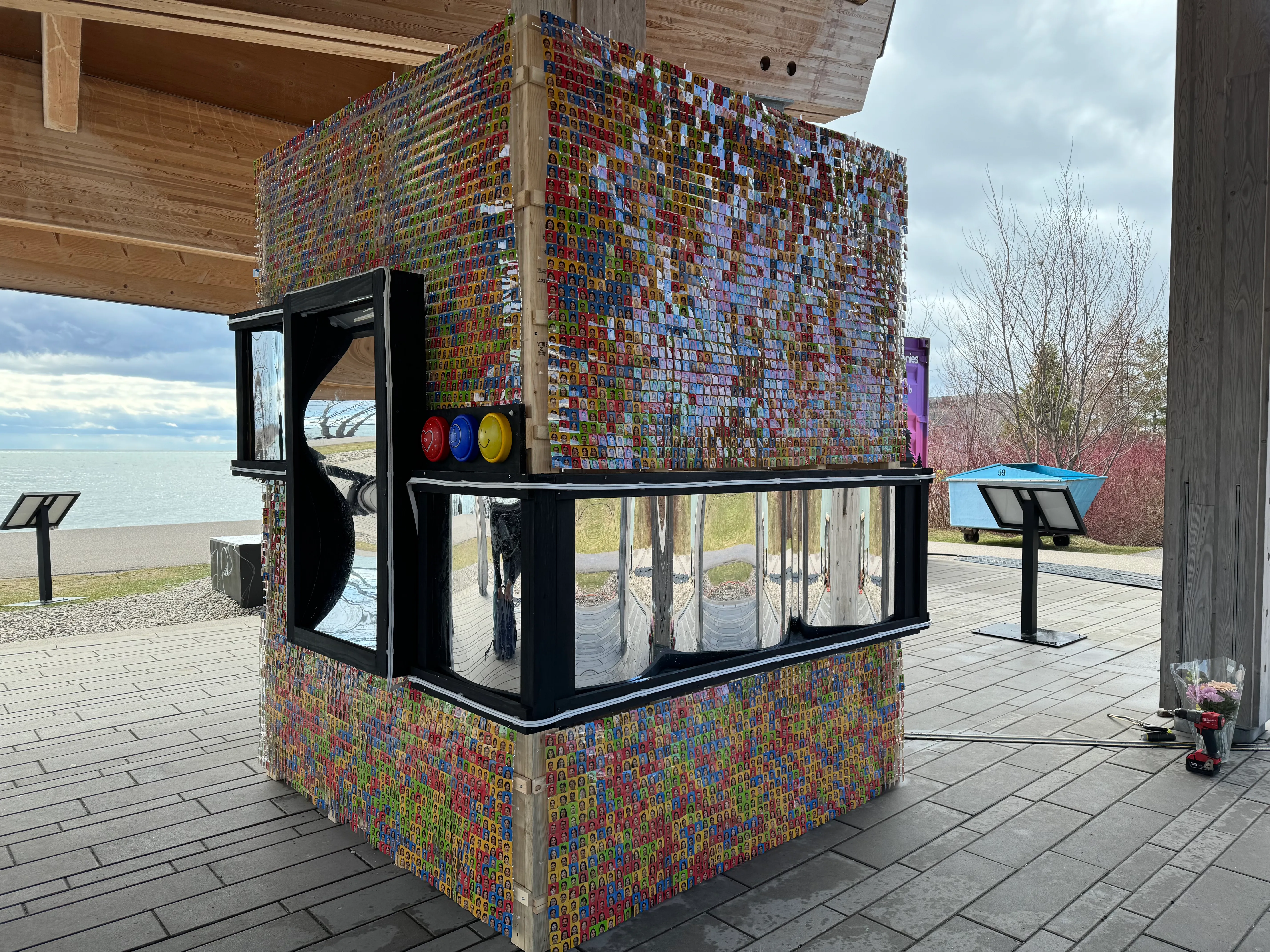 Virtual Visage's mirrored installation covered in thousands of colourful portraits
